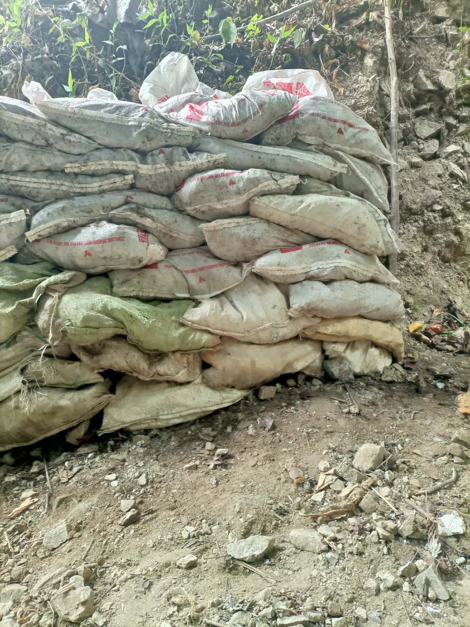 Additional rows of filled sacks held at a mineral source site