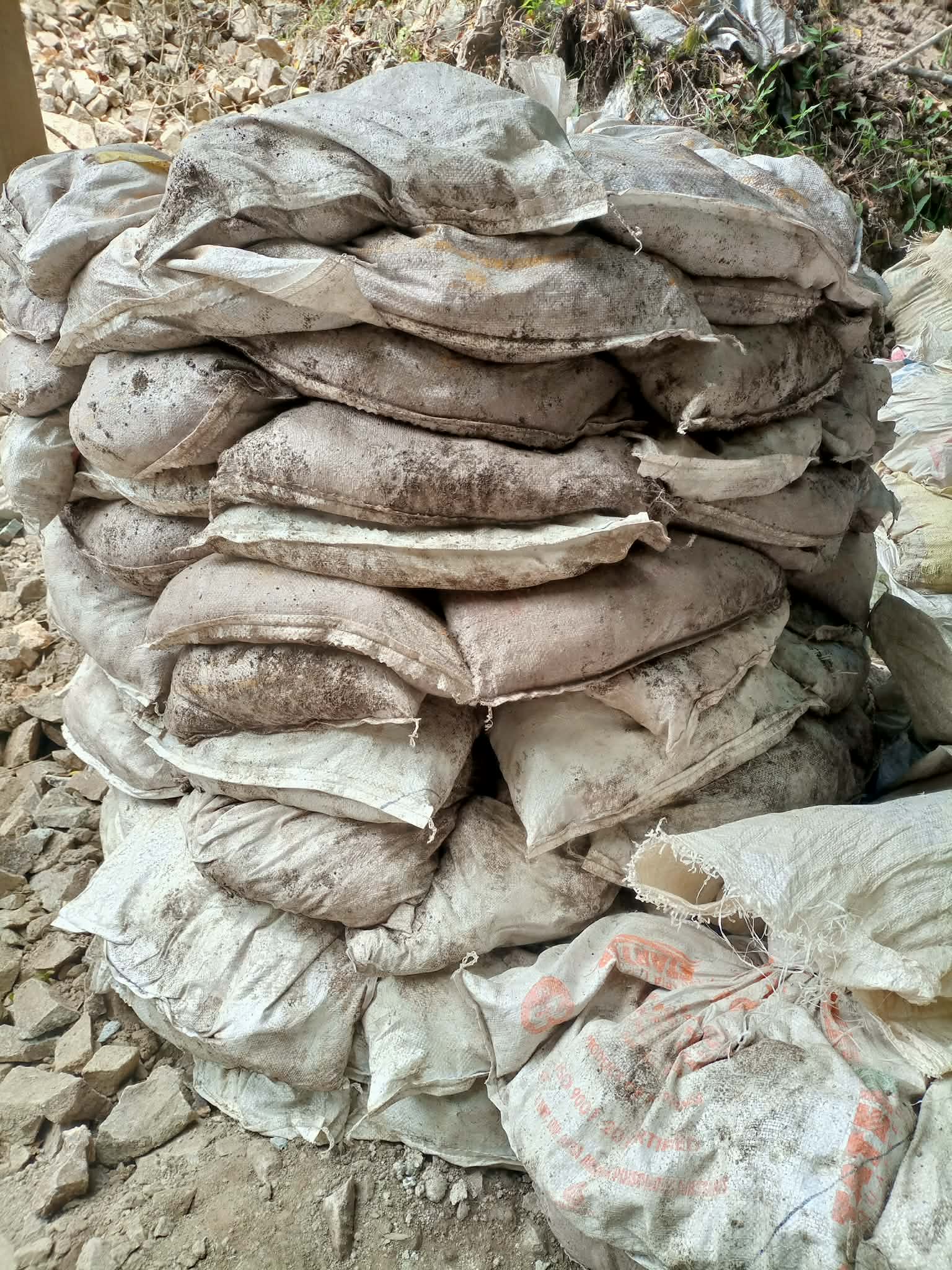 Stacked sacks of mineral material ready for further checks