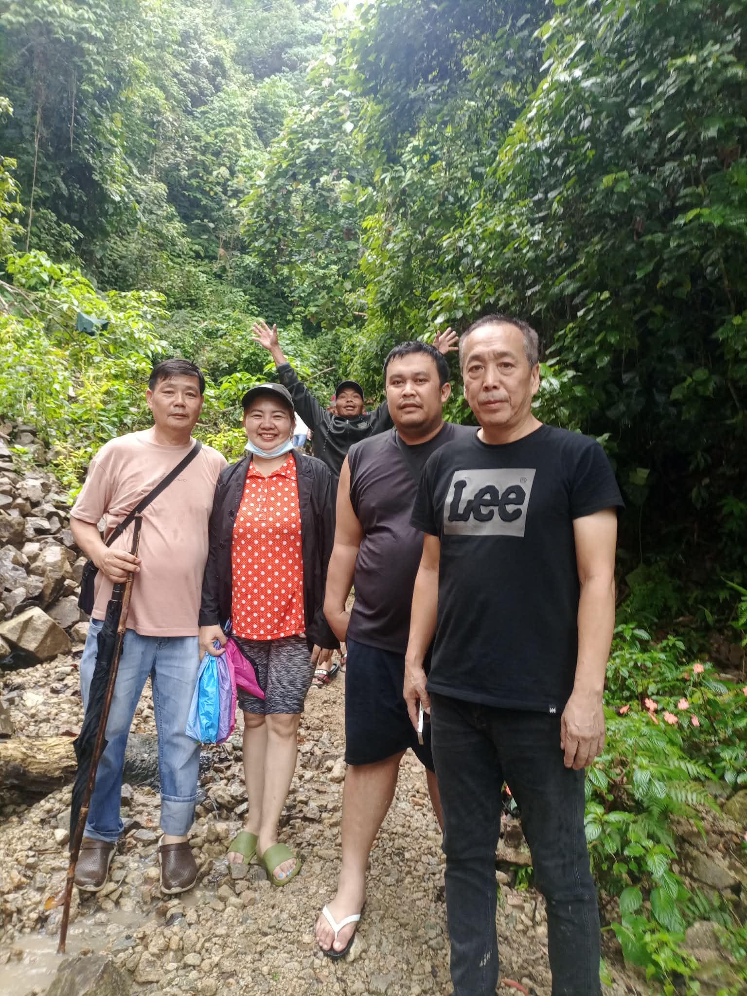 Camotto representatives and local miners together at a forested field site